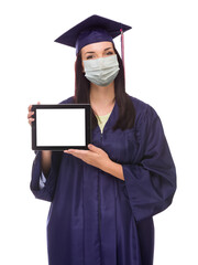 Graduating Female Wearing Medical Face Mask and Cap and Gown  Holding Blank Computer Tablet Isolated on a White Background