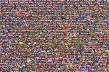 Aerial view of a vast crowd of people worshipping at Gore Shahid park in front of Eid Gah Minar religious site in Dinajpur, Rangpur, Bangladesh.