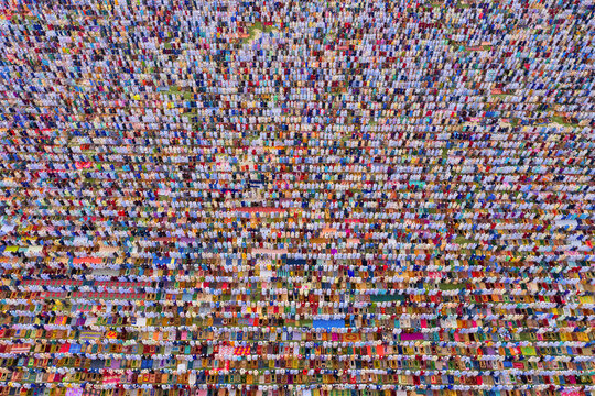 Aerial view of a vast crowd of people worshipping at Gore Shahid park in front of Eid Gah Minar religious site in Dinajpur, Rangpur, Bangladesh.