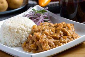 Teasty Peruvian food Carapulcra made with dry potatoes saute with chiken pork spices and red hot peppers sauce 