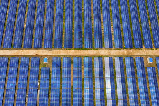 Aerial view of solar panels blue pattern along Karnaphuli river in Kaptai, Chittagong state, Bangladesh.