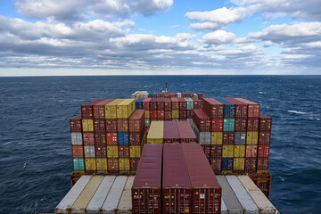 Large container ship transiting Panama Canal, view on the deck loaded with containers. 