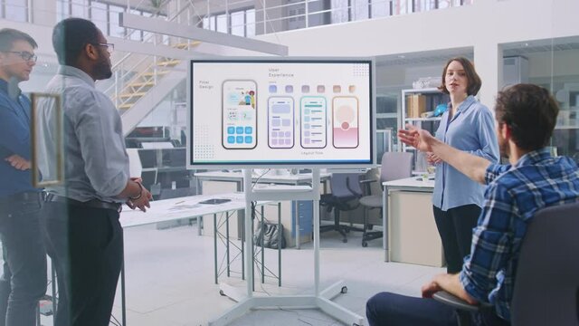 Office Conference Room Meeting: Caucasian Female CEO Doing Food Delivery Software App Presentation to a Diverse Multi-Ethnic Team of Businesspeople, Explaining UI UX Working, Customer Support