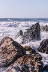 waves crashing on rocks