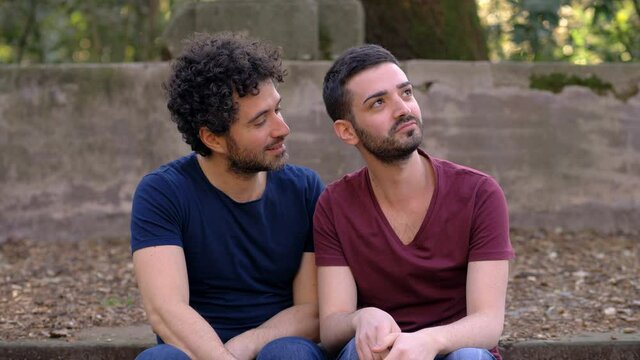 failed gay approach - young man tries to kiss his friend who reacts annoyed 