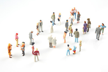 miniature people. different people communicate with each other on a white background