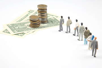 miniature people. different businessman stands near dollar money. investments and earnings for work