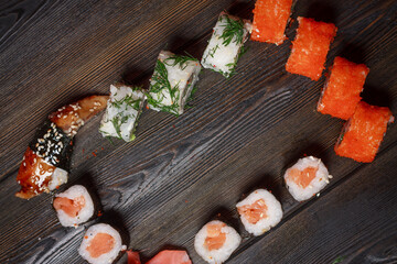 sushi rolls chopsticks japanese cuisine delivery meal wooden table