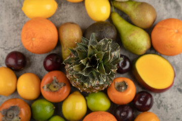 Assortment of fresh ripe fruit composition on marble surface
