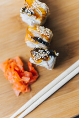 sushi chopsticks wood board restaurant top view