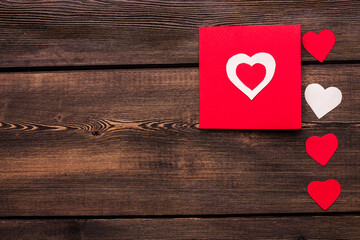 paper hearts on a wooden background postcard texture Valentine's day