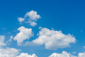 Naklejka na ściany i meble White clouds and blue sky background, sunny weather
