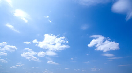 Sunny blue sky background and white cloudscape