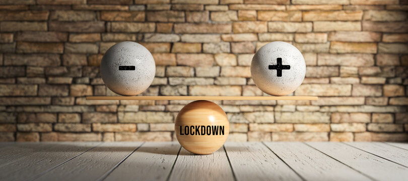spheres forming a scale with message LOCKDOWN and plus und minus symbol in front of a brick wall