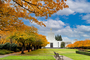 The Oraegon State Capitol building and japanese cherry blossom trees showing brilliant fall colors in Salem Oregon