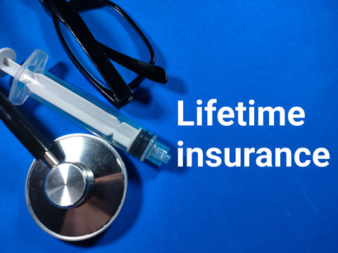 Selective Focus.Word Lifetime Insurance With Stethoscope,syringe And Glasses On Blue Background.Medical Concept.