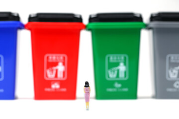 color trash can trash sorting with a woman standing 