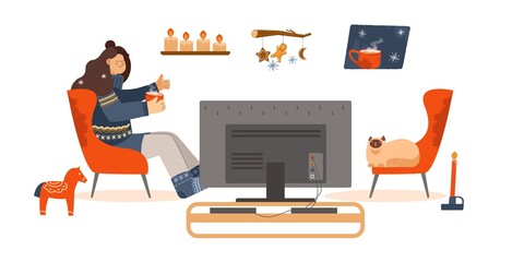watch TV. girl on a chair watching a movie. cozy home. hygge style. Scandinavian things. Stay home collection © elenshi