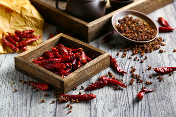 dried pepper in wooden box