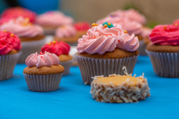 cupcakes with cream and sprinkles