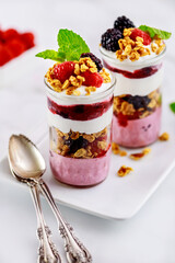 Raspberry trifle with berry pudding and granola.