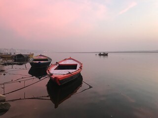 Obraz na płótnie Canvas Row Boats on the Ganges River in Varanasi India - Calm Water