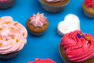 cupcakes with pink icing and sprinkles