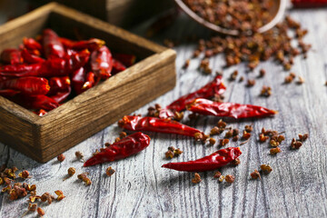 dried pepper in wooden box