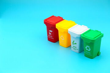 colorful trash sorting can  on blue background