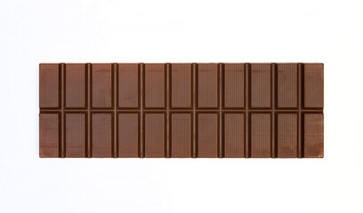 sweet and delicious whole chocolate bar is lying on white background, photo taken from above