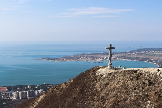 Hiking to the top of the mountain and views of the center of the resort town, the sea and attractions. Stunning spring landscape, especially the new Orthodox cross on the mountain. Russia, Gelendzhik