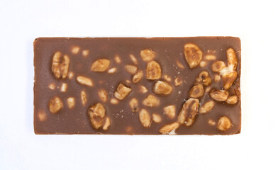 sweet and delicious whole chocolate bar is lying on white background, photo taken from above