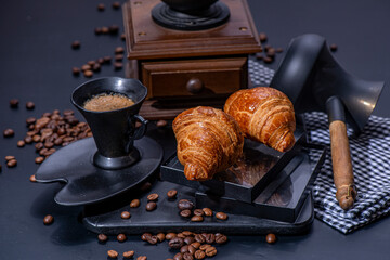 Cup of coffee and croissants