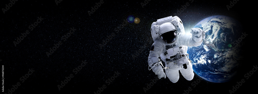 Wall mural astronaut spaceman do spacewalk while working for space station in outer space . astronaut wear full