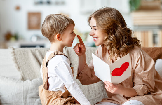 Mother and son reading greeting card