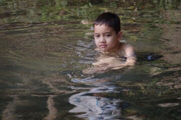 Fototapeta premium Boy in the water