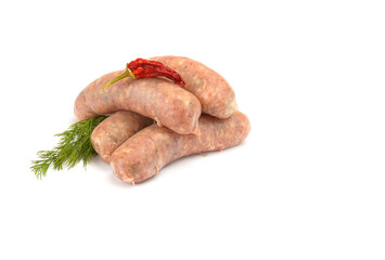 Raw pork sausages. Grilled sausages, spices close-up, isolated on a white background.Selective focus.