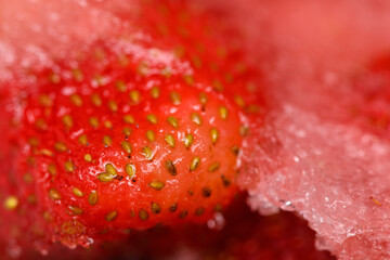 Frozen strawberries covered by frost, berry Victoria, close-up. Berry in ice
