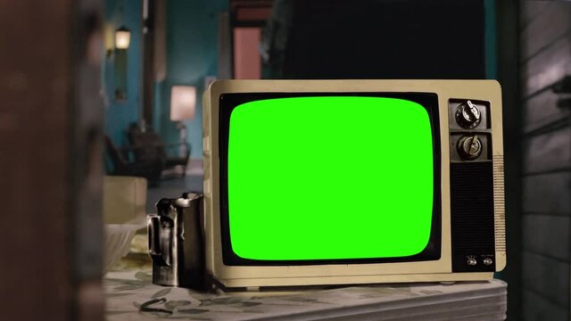 Vintage Television Set Green Background with Noise, Color Bars and Static. You can replace green screen with the footage or picture you want. You can do it with “Keying” effect in After Effects. 4K.