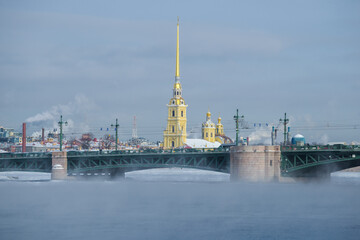 Palace Bridge and Peter and Paul Cathedral on the winter Neva river on a frosty day. Saint-Petersburg, Russia