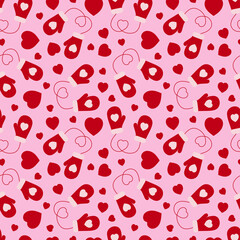 Seamless pattern of mittens and hearts on a pink background.