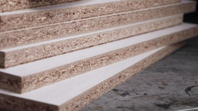 Detail of stack of laser cut white melamine boards