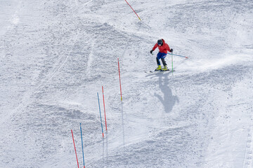 Beautiful texture created by skiers descending the mountain. Sportsman descends along the snowy...