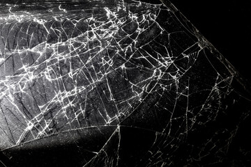 Broken black glass as background.
