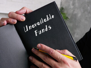  Financial concept meaning Unavailable Funds with inscription on the page.