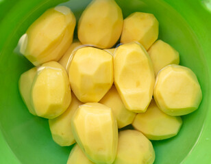 Peeled washed potatoes in a ish.