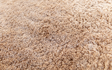 Terry texture of the rug on the floor.