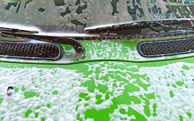 car wash of a green vehicle