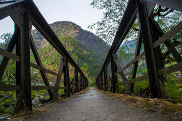 village bridge way to mountains