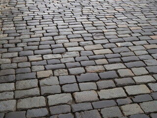 dirty gray cobbled road perspective